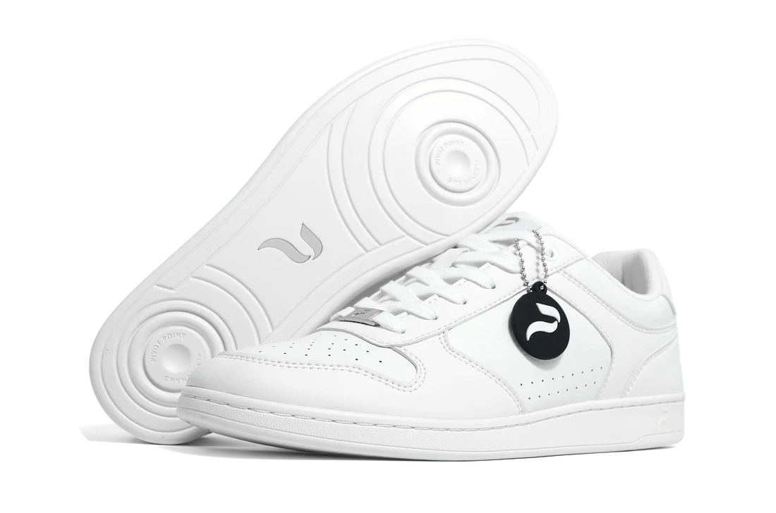 The Flow 2 White dance sneaker with the SPYNFLEX&reg; sole exposed, both pivot discs facing the camera